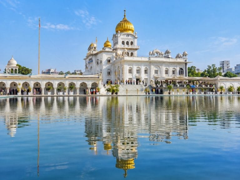 Delhi Monuments & Attractions Gurudwara Bangla Sahib in Delhi with golden domes reflected in the sacred sarovar