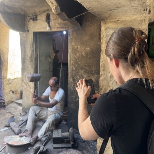 Guest visiting a traditional artisan workshop during a Jaipur Heritage Walk