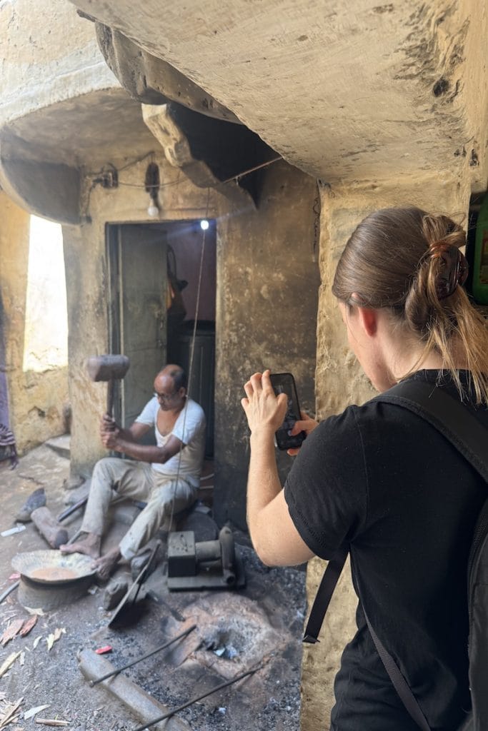 Guest visiting a traditional artisan workshop during a Jaipur Heritage Walk