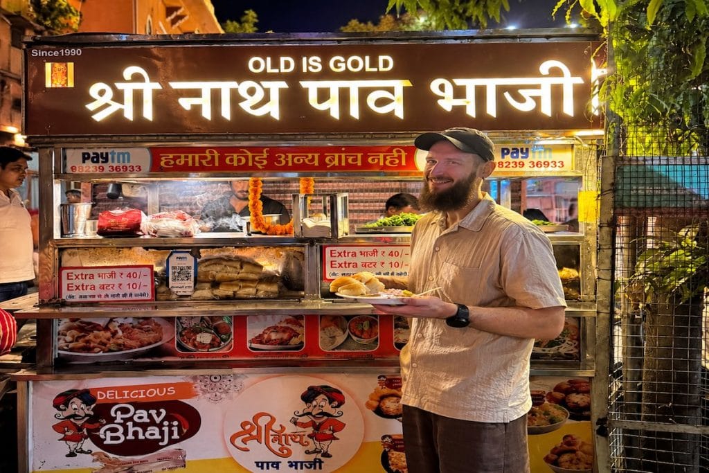 Local vendor preparing pav bhaji on a Jaipur street food tour