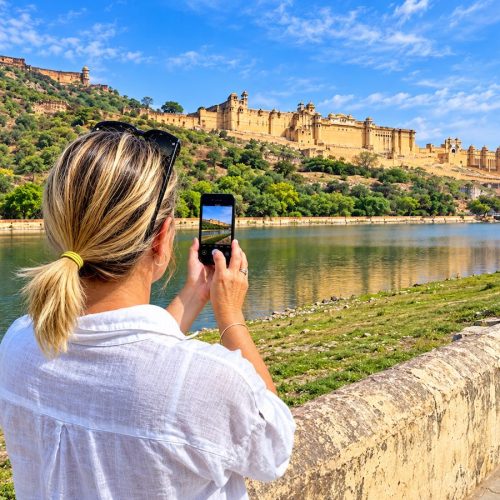 Traveller photographing Amber Fort in Jaipur during a Rajasthan tour