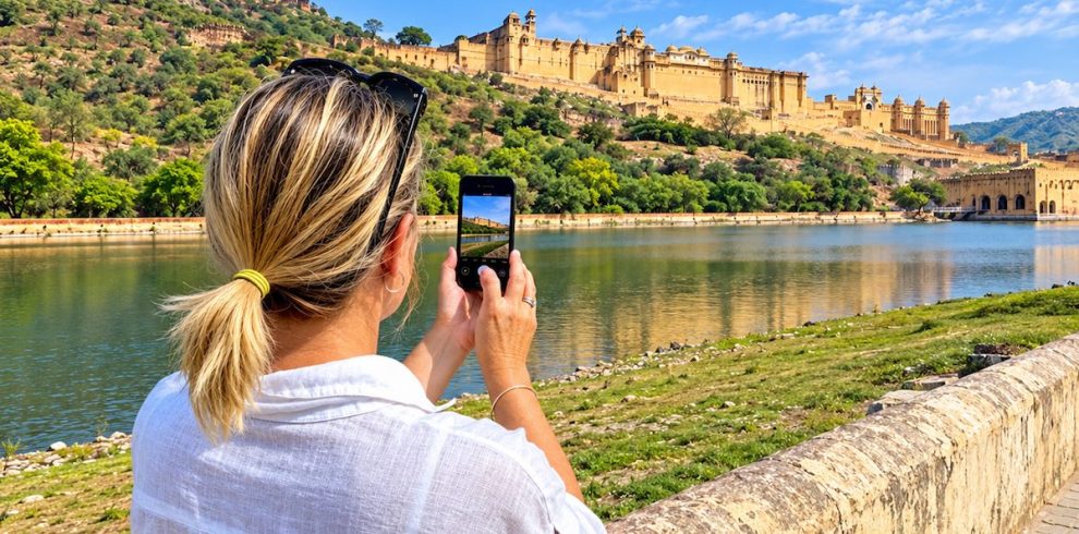 Traveller photographing Amber Fort in Jaipur during a Rajasthan tour