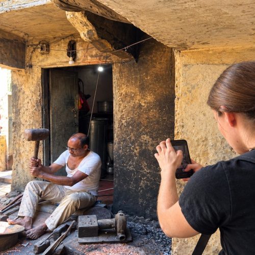 Traveller watching a local artisan during a Jaipur cultural experience